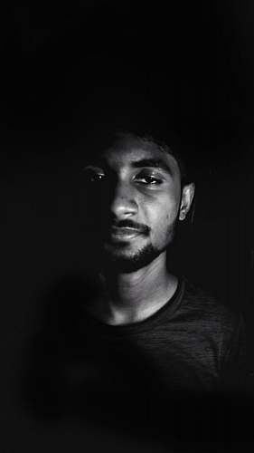 black-and-white grayscale photo of crew-neck top face