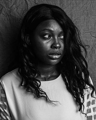 black-and-white grayscale photography of woman wearing crew-neck top face