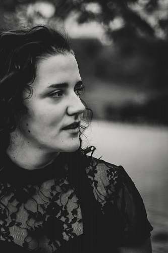 black-and-white grayscale photography of woman wearing lace short-sleeved top face