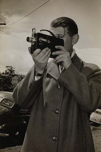 person man holding black camera photography
