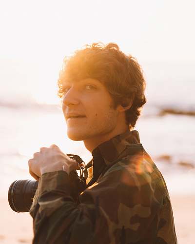 person smiling man holding camera close-up photography photographer
