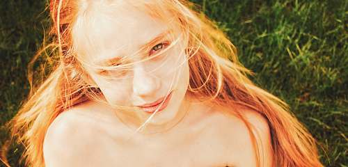 person woman at green grass face