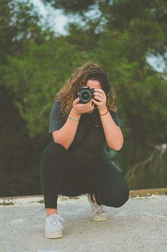 person woman taking photo apparel