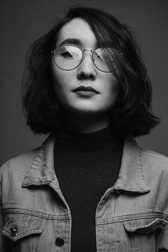 person woman wearing eyeglasses black-and-white