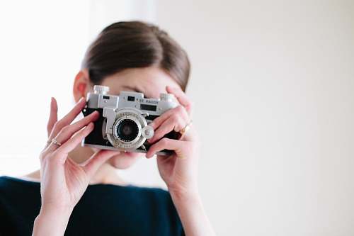 camera woman using camera taking photo human