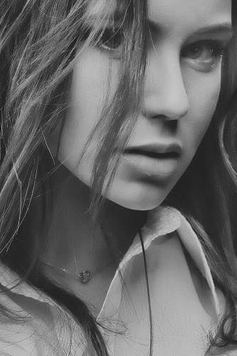 black-and-white grayscale photography of woman wearing collared topp face