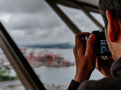 human man taking photo of island photographer