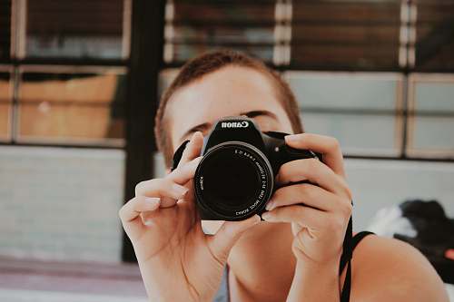 human woman taking photo camera