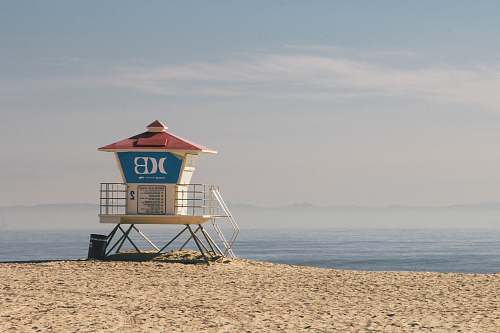 sea white and blue watch house near on body of water water