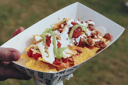 food white and red ceramic plate nachos