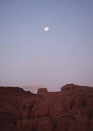 outdoors brown cliff across gray moon mesa