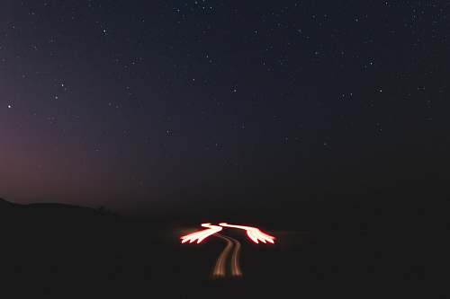 outdoors person doing fire dance during night time night
