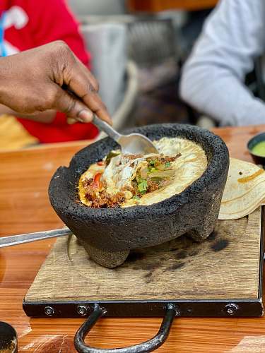 human bowl of food on wooden surface food