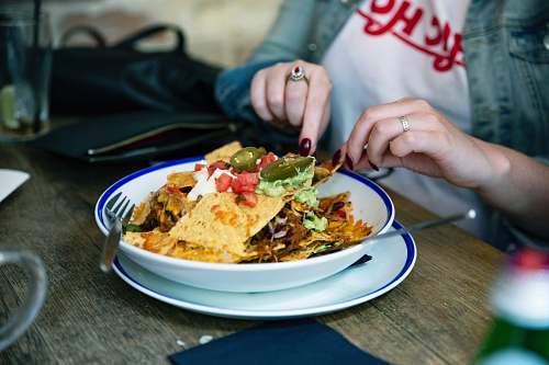 human people sitting in front of table food