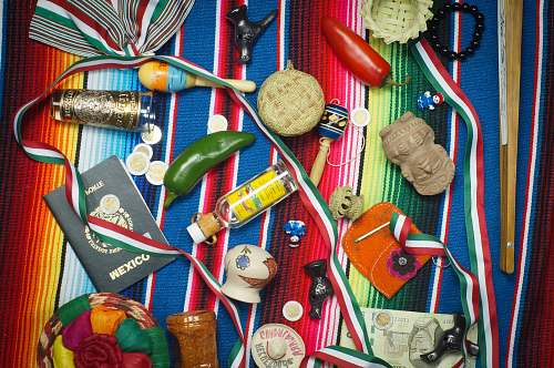 flatlay flat lay photography of vial, medal, and book on striped cloth flatlay lifestyle