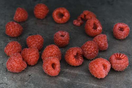 fruit red round fruits on gray textile raspberry