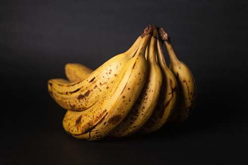 fruit yellow banana fruit on black textile banana