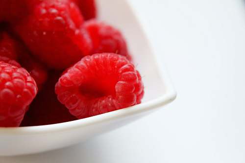 raspberry red raspberry on white ceramic bowl food