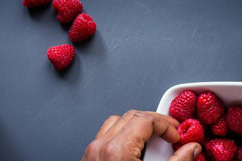 food red strawberries in white plastic container plant