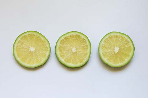 food sliced lemon on white surface citrus fruit