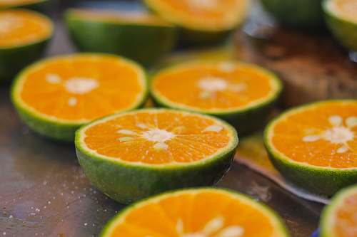 food sliced orange fruit on brown wooden table orange
