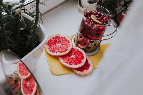 food sliced orange fruit on white plate citrus fruit