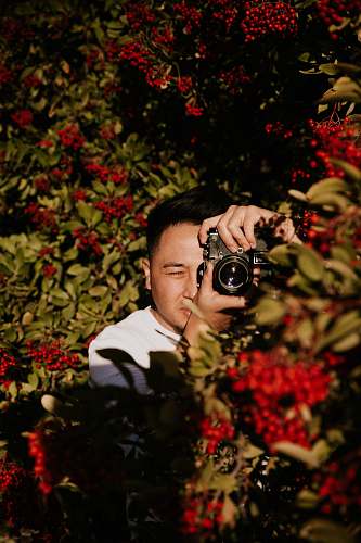 human man holding camera person