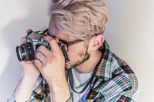 person man taking photo using camera human