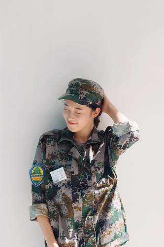 apparel woman wearing camouflage uniform hat