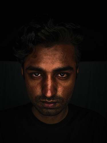 person men wearing black crew-neck shirt close-up photography human