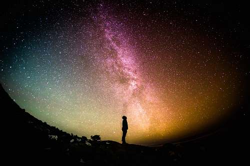 night silhouette photography of person universe