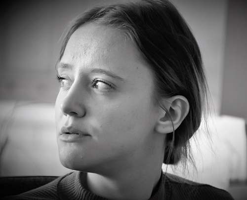 black-and-white grayscale photo of woman wearing top face
