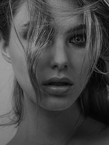 face grayscale photography of woman black-and-white