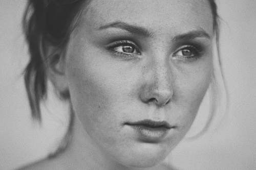 face greyscale photo of woman black-and-white
