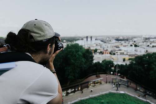 person man taking photo og landscape photo
