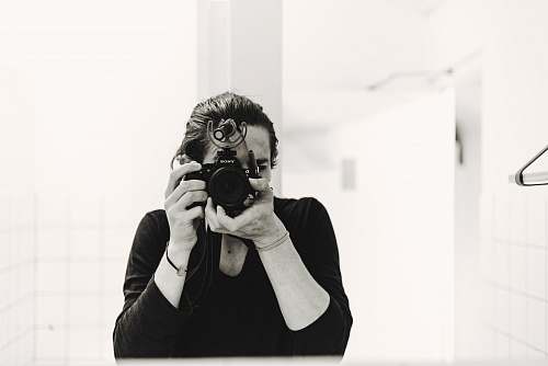person person taking photo camera