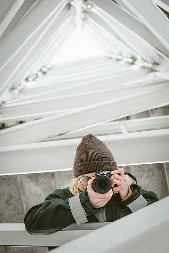 photographer person using camera during daytime camera
