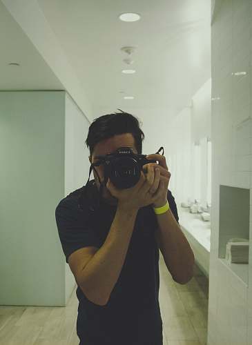 person unknown person taking selfie indoors camera