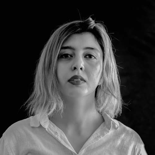 black-and-white woman wearing collared top face