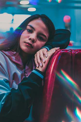person woman wearing gray zip-up jacket face