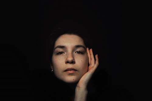 person woman's face on black background face