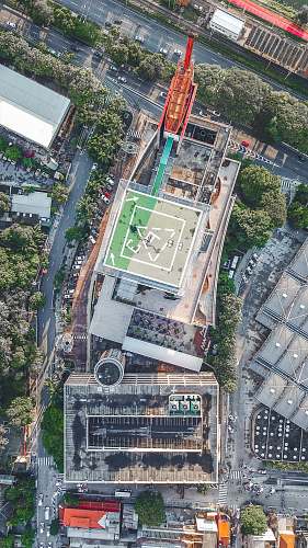 nature aerial photography of building surrounded with trees at daytime outdoors