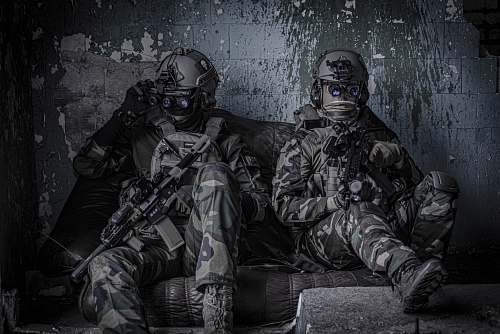 clothing two officers sitting on sofa apparel