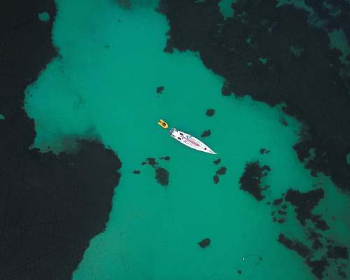 water aerial photo of speedboat sea