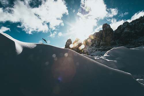 outdoors white mountain across clouds mountain