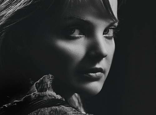 face grayscale photography of woman black-and-white