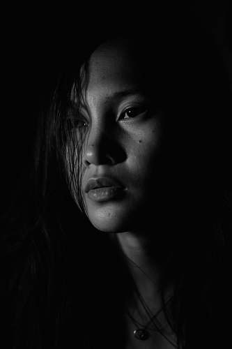 black-and-white grayscale portrait photo of woman face