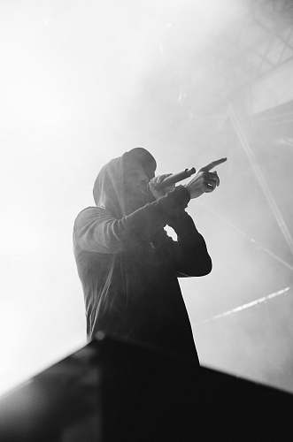 black-and-white man in black hoodie in grayscale photo grey