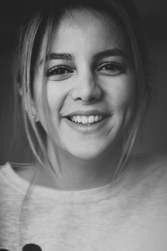 face portrait photograph of woman in crew-neck shirt black-and-white
