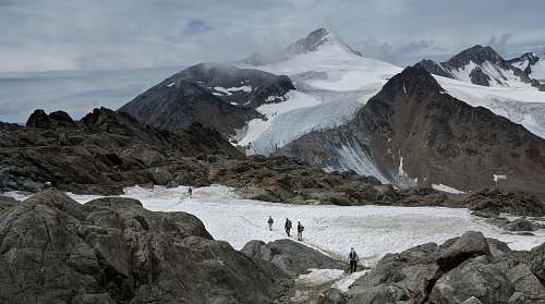 snow group of people hiking on snowy mountains mountain